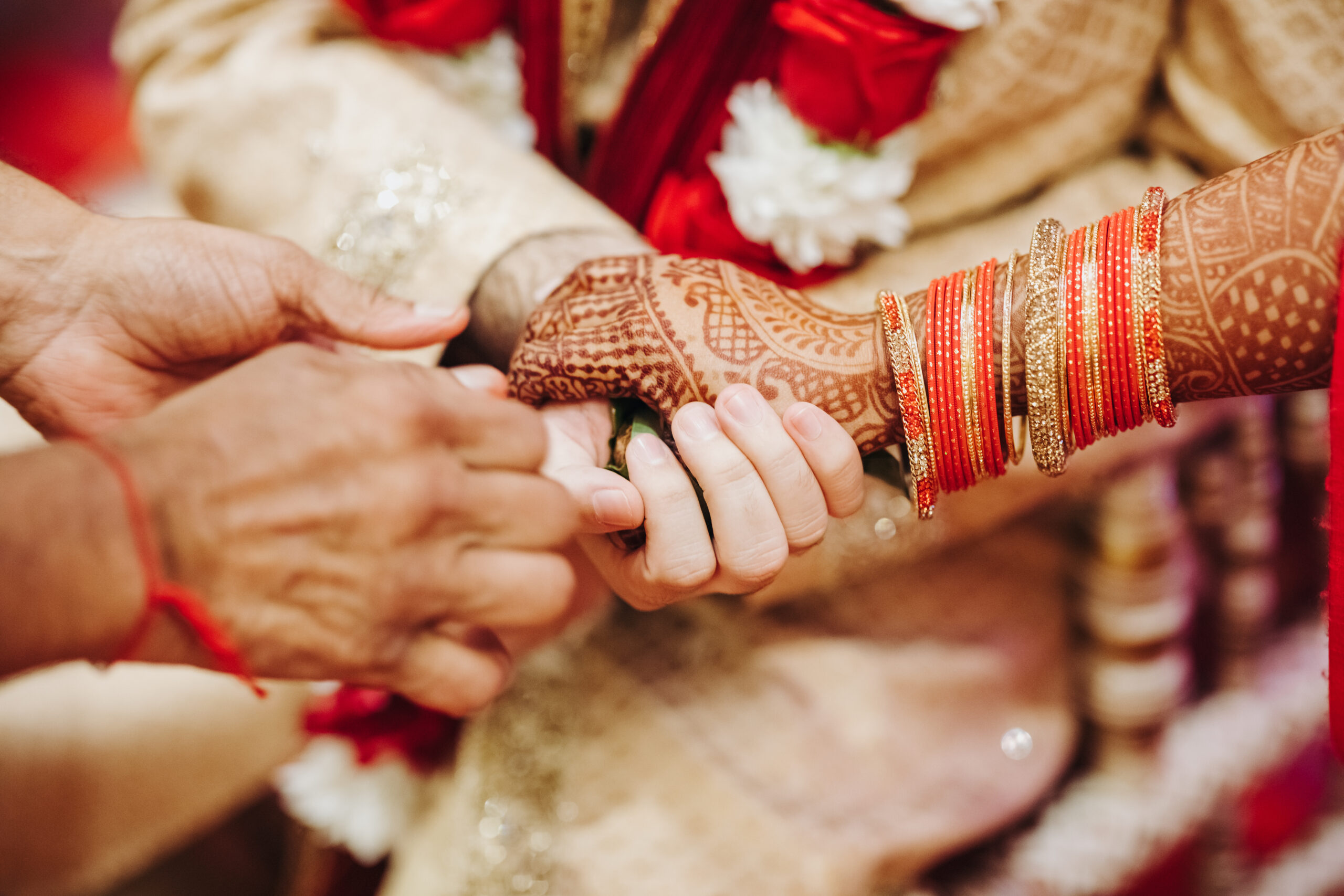 Ritual with coconut leaves during traditional Hindu wedding cere